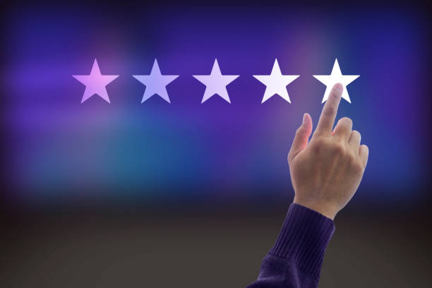 Rating with five stars for a satisfaction and enjoyment Hand of a man giving high score with five stars rating for movie or television programme or anything that having the required qualities. Show the feeling of a satisfaction and enjoyment. "r admired stock pictures, royalty-free photos & images