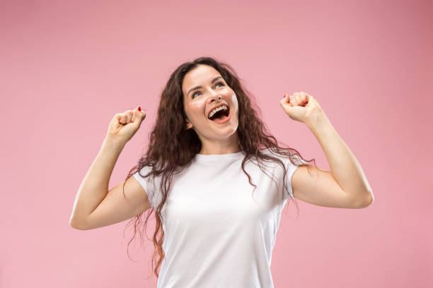 istock Winning success woman happy ecstatic celebrating being a winner. Dynamic energetic image of female model 1044319798
