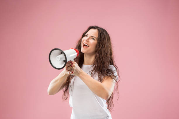istock Woman making announcement with megaphone 1044319838