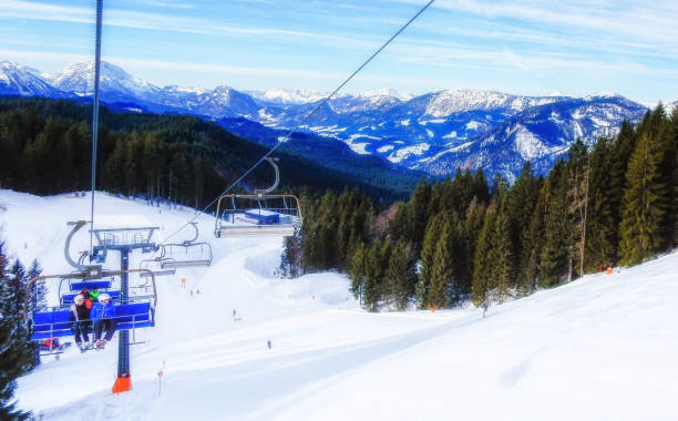 istock People skiing and snowboarding on a slope at ski resort 1044320054