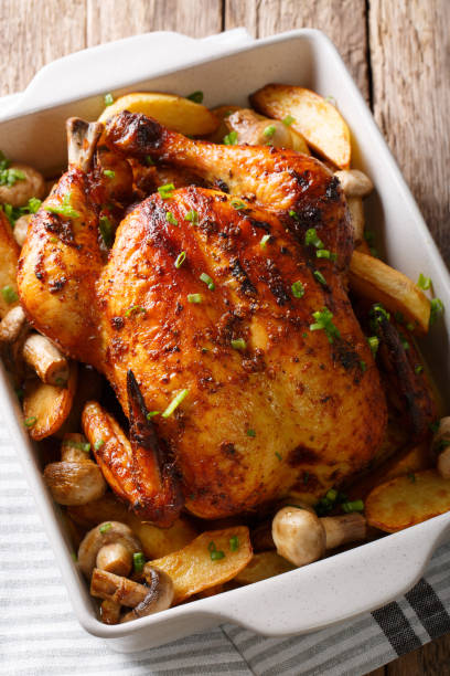 istock Homemade food: baked chicken with mushrooms and potatoes close-up. vertical 1044323608