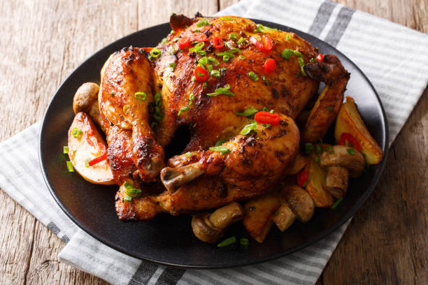 istock Grilled food: chicken with mushrooms and potatoes close-up on a plate. horizontal 1044323830