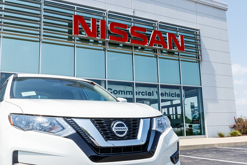 Fishers - Circa August 2018: New vehicles at a Nissan Car and SUV Dealership. Nissan is part of the Renault–Nissan Alliance VII