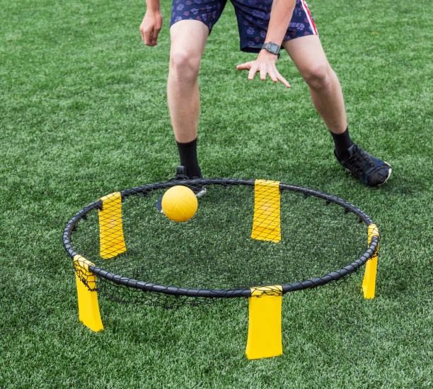 istock Playing spike ball on green turf 1044327100