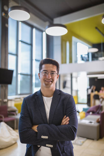 istock Smiling businessman in a modern office 1044330870