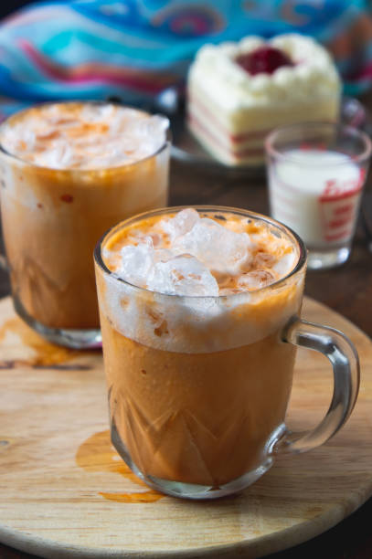 istock thai tea milkshank sweet drink on the glass for refreshment 1044334242