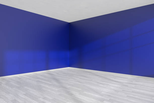 istock Corner of empty blue room with white floor 1044335658