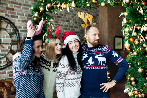 istock Friends celebrating Christmas at home 1044339028