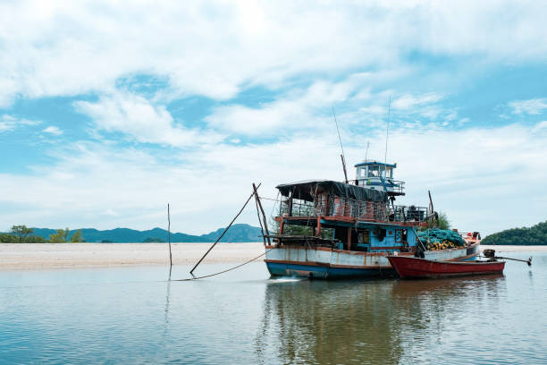 istock Beautiful ocean with fisherman boat 1044343192