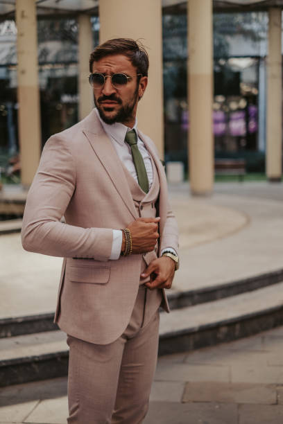 istock Businessman adjusting his vest outside 1044346660
