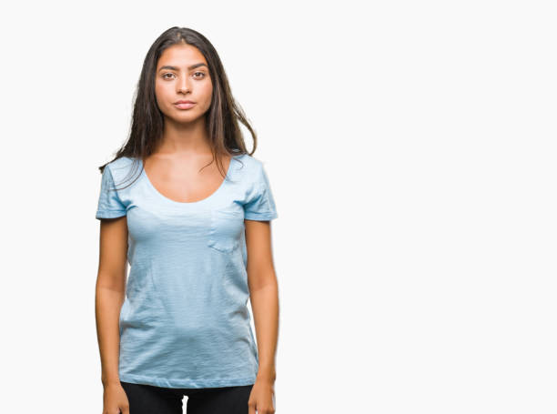 istock Young beautiful arab woman over isolated background with serious expression on face. Simple and natural looking at the camera. 1044346832