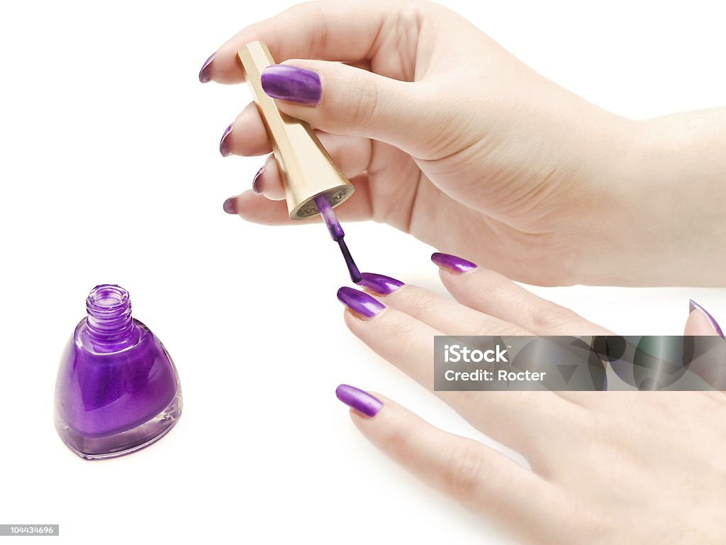 manicure manicure process: nail polish and woman hands over white background Beauty Product Stock Photo