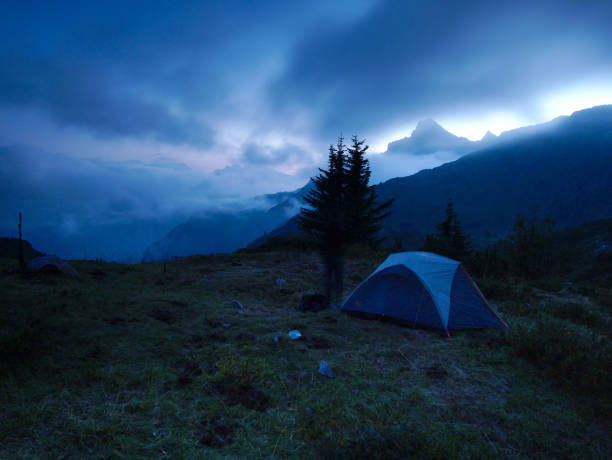 istock Tent in a mountain landscape at dusk 1044347472