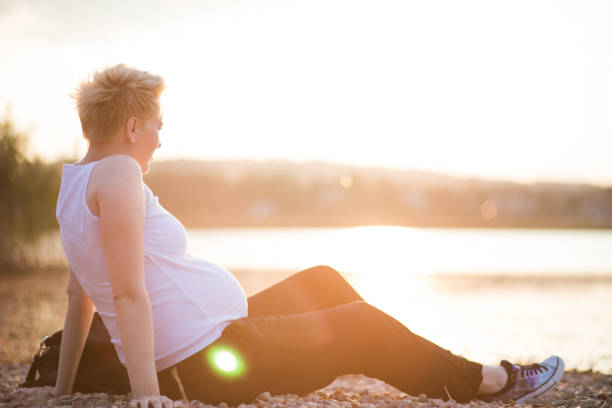 Pregnant woman at sunset