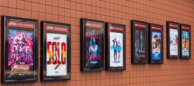 Hickory, NC, USA-6 June 18: Posters advertising movies showing in a  local AMC movie theater.