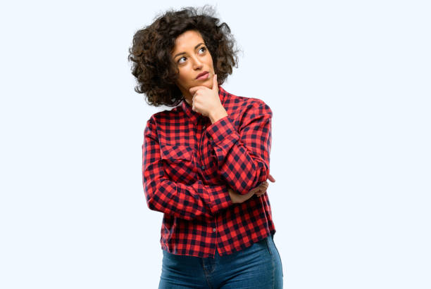istock Beautiful arab woman thinking thoughtful with smart face 1044357600
