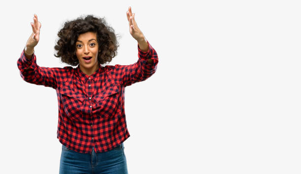 istock Beautiful arab woman happy and surprised cheering expressing wow gesture 1044357680