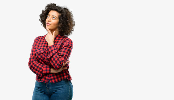 istock Beautiful arab woman thinking and looking up expressing doubt and wonder 1044357690