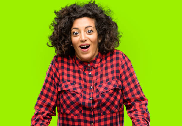 istock Beautiful arab woman scared in shock, expressing panic and fear 1044357768