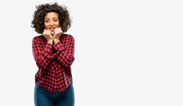 istock Beautiful arab woman happy and surprised cheering expressing wow gesture 1044357778