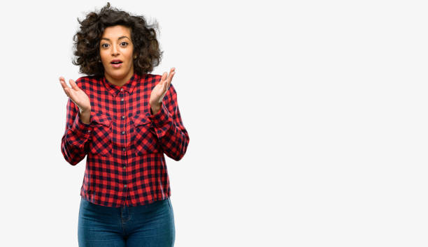 istock Beautiful arab woman happy and surprised cheering expressing wow gesture 1044357890