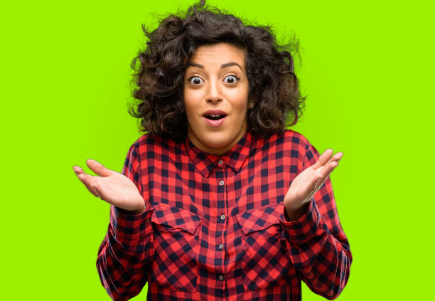 istock Beautiful arab woman happy and surprised cheering expressing wow gesture 1044357924