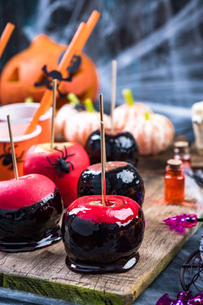 istock Glazed candy apples at Halloween party 1044358114
