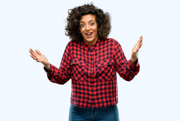 istock Beautiful arab woman happy and surprised cheering expressing wow gesture 1044358130