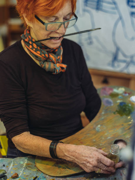 istock Senior woman artist at work 1044361196
