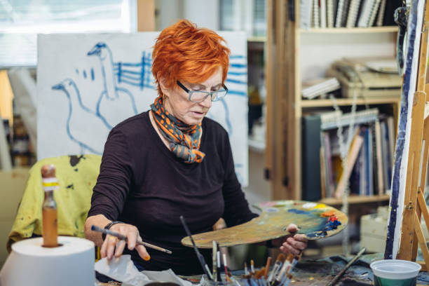 istock Senior woman artist at work 1044362178