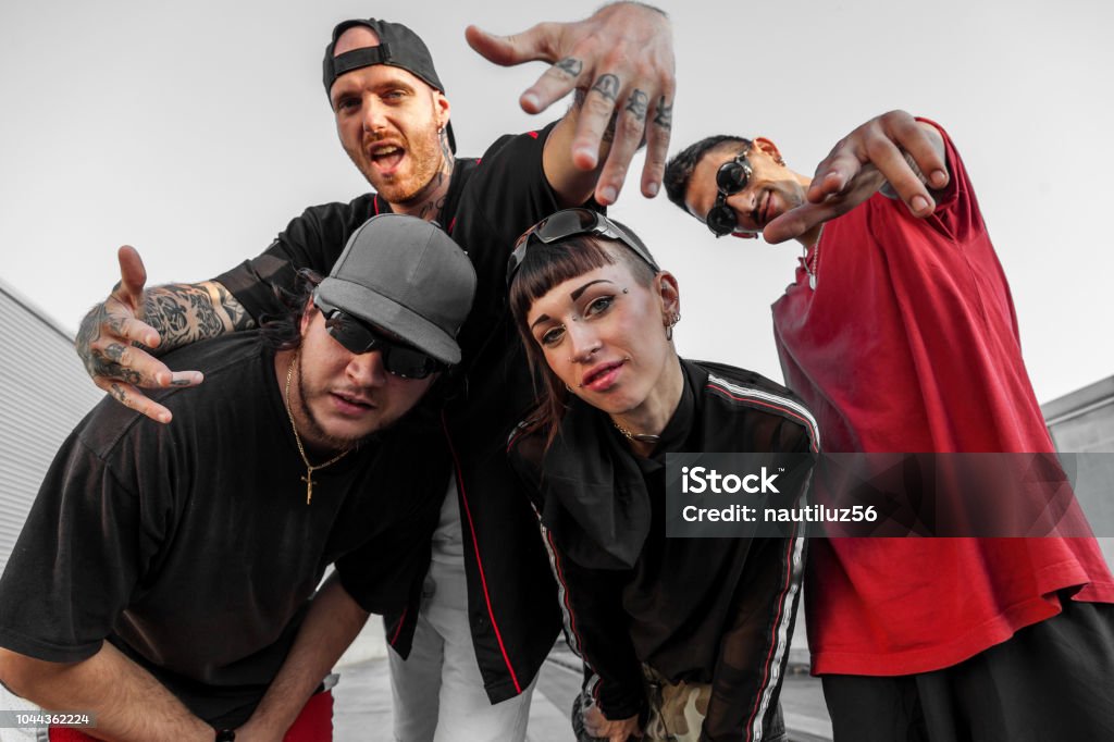 group of rappers posing on the metal rooftops group of rappers posing on the metal rooftops of an abandoned building Rap Stock Photo