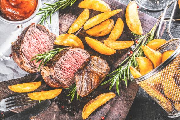 istock Delicious beef steak with ketchup and Potatoes 1044362272