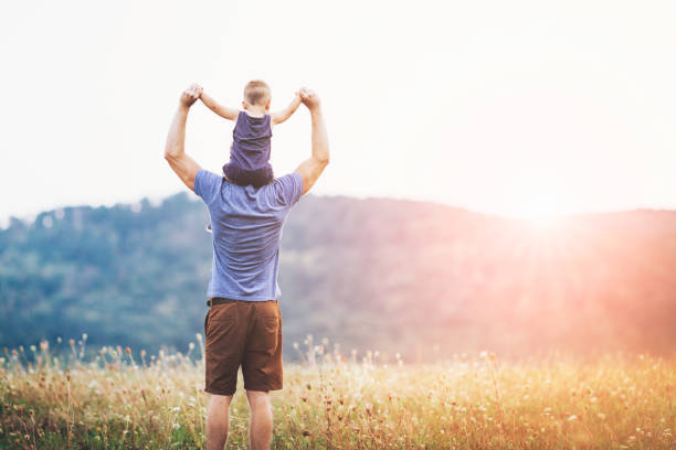 istock Happy father and son on a walk outdoors 1044367476