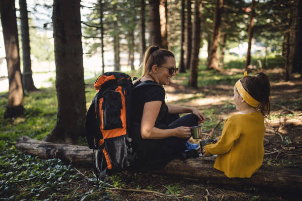 istock Lovely family relaxing in a forest with some tea 1044373812