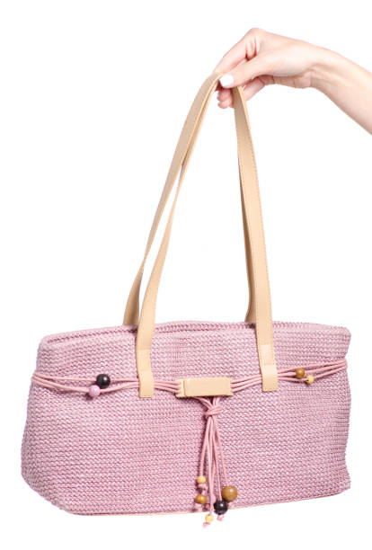istock Female pink bag in hand 1044376436