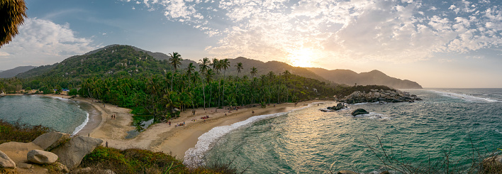Hermosa playa del Caribe con palmeras y puesta de sol en el Parque Nacional Tayrona, cerca de Santa Marta al norte de Colombia photo