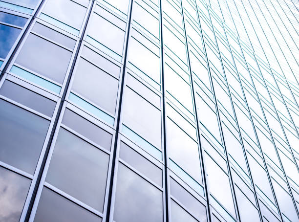 istock underside panoramic and perspective view to steel blue glass high rise building skyscrapers, business concept of successful industrial architecture 1044377778