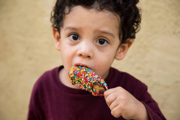 istock portrait child eating palette 1044381036