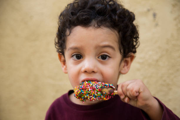 istock portrait child eating palette 1044381076