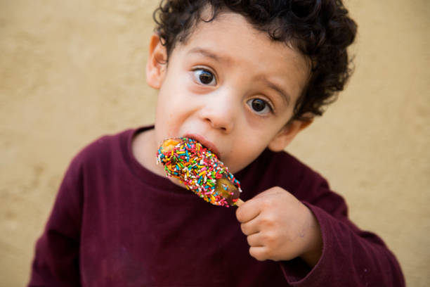 istock portrait child eating palette 1044381078