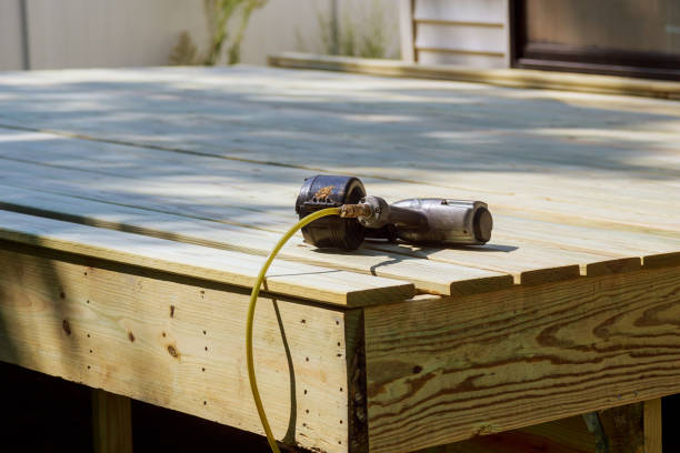 istock Worker Installing wooden floor Air Nail Gun on the 1044381326