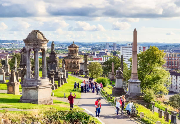 Glasgow, Scotland - Visitors to Glasgow's Necropolis, sited on a hill near the city centre, and the resting place of many famous Scots.