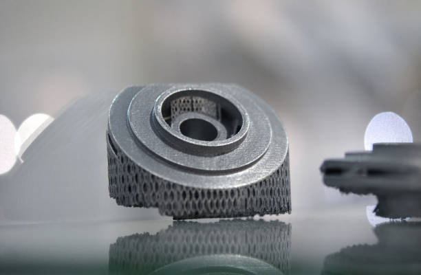 istock Selective Laser Melting. Object printed on metal 3d printer close-up. 1044392054
