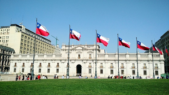Santiago, Chile - April 20 of 2018: Photo taken in front of the Presidential Palace known as La Moneda located in the city next to the subway station with the same name. A famous historical and touristic spot.