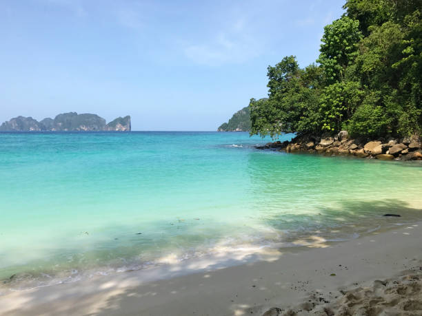 istock Crystal clear water and sand at Long Beach in Ko Phi Phi Islands, Thailand 1044395118