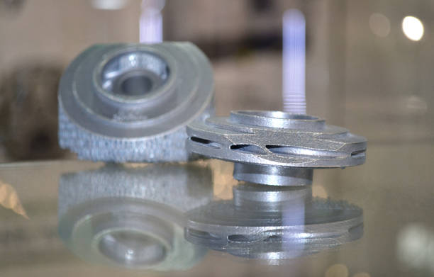 istock Selective Laser Melting. Object printed on metal 3d printer close-up. 1044395868