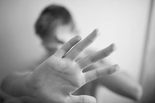 istock Boy teenager protects himself with his hands 1044396372
