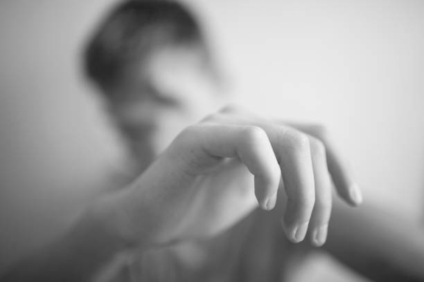 istock Boy teenager protects himself with his hands 1044396378