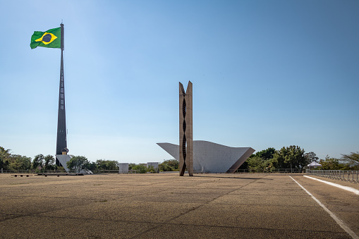 Brasilia, Brazil - Aug 26, 2018: Three Powers Plaza (Praca dos Tres Poderes) and Brazilian Flag - architecture by Oscar Niemeyer - Brasilia, Distrito Federal, Brazil