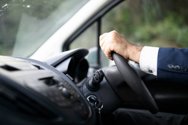 Driving At UK Businessman driving right handed car right handed stock pictures, royalty-free photos & images